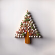 Top view of small wooden sticks put together to form a Christmas tree on a white tabletop, minimal handmade top view