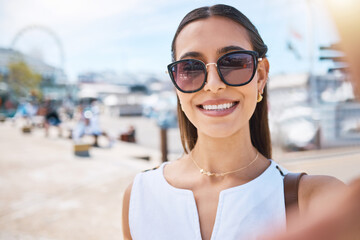 Travel, happy or woman taking selfie on holiday vacation in summer in Las Vegas, USA with freedom. Smile, fashion sunglasses or portrait of cool girl tourist taking pictures for social media content