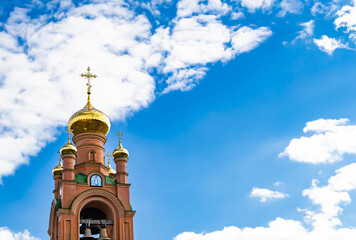 Christian church cross in high steeple tower for prayer