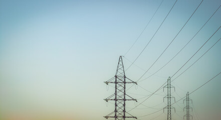 Wall Mural - High voltage electricity power line towers against the sky.  Transmission towers