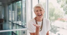 Senior Woman, Blow Kiss And Office With Smile, Silly And Happiness On Face At Insurance Business. Happy Corporate Executive, Old Woman And Blowing Kisses For Comic Portrait At Workplace In Toronto