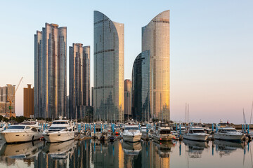 Wall Mural - Busan city skyline and skyscraper at Haeundae district with yacht pier at Busan, South Korea, Busan, South Korea city skyline in the Haeundae district.