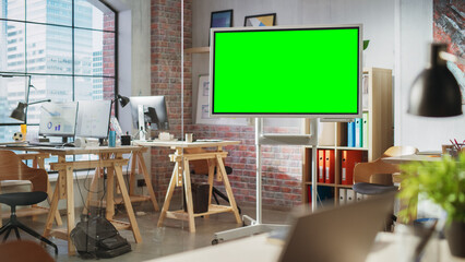 Poster - Empty Conference Room for Team Meetings in Modern Creative Agency with Art on Walls and Desks with Computers. Office Space with Digital Green Screen Mock Up Chroma Key Monitor for Presentations.