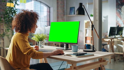 Aufkleber - Confident Arab Businesswoman Working on Implementing Modern Business Strategy in Creative Agency. Specialist Writing Corporate Project Plan on Desktop Computer with Green Screen Mock Up Display.