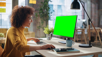 Aufkleber - Middle Eastern Female Working in Creative Agency, Implementing Modern Business Strategy for Clients. Successful Specialist Using Computer with Green Screen Mock Up Display.