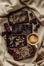 Set Of Various Homemade Chocolate Bars With Coffee Mug