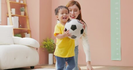 Wall Mural - Family playing with soccer ball