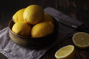 Wall Mural - A bowl with yellow bright lemons