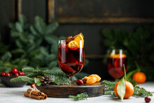 Christmas Mulled Wine On Christmas Background. Hot Christmas Beverage With Orange And Cranberry. 