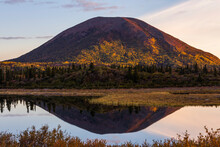 Donnelly Dome Reflects In Donnelly Lake At Sunrise In The Autumn; Alaska, United States Of America