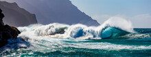 Large Waves Crashing Along The Rugged Coastline Of The Na Pali Coast At Ke'e Beach; Kauai, Hawaii, United States Of America
