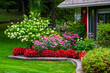 © Designpics - Blossoming flowers decorating the yard of a house; Hudson, Quebec, Canada
