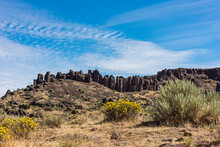 Basalt Columns Formed When Molten Lava Cooled Towering Over The Eastern Washington High Desert Near George; Washington, United States Of America