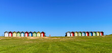 Colourful Painted Structures Used For Change Rooms At The Beach On The Coast; Blyth, Northumberland, England