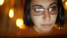 Closeup Of Woman Working On Laptop To Research Cryptocurrency Financial Markets. Trader Wearing Glasses Working At Christmas Eve. Analyzing Stock Market To Make Investment During Winter Holidays.