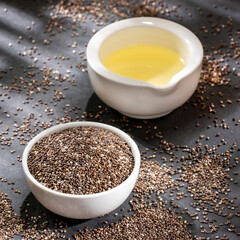 Wall Mural - Salvia hispanica - Bowl with chia oil and organic seeds