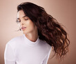© J Bettencourt/peopleimages.com - Beauty, salon and woman with hair movement for hair care, shampoo products and keratin treatment in studio. Fashion, cosmetics and girl pose for wellness, healthy hairstyle and hair salon aesthetic