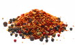 Spicy mixture of spices with chopped lemon peel, pile chili, peppercorns (black, green and red), mustard seeds, allspice, chopped ginger, isolated on white, side view