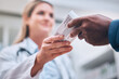 © J Bettencourt/peopleimages.com - Pharmacy, medication box and pharmacist helping a patient with medical prescription at clinic. Medicine, healthcare and guy getting pills, cure or treatment at a pharmaceutical drug store or chemist.