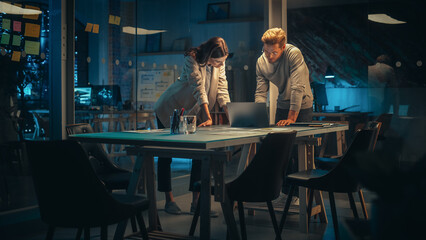 Aufkleber - Accountant Bringing a Financial Report to a Meeting with a Marketing Manager of a Creative Agency. Two Young Colleagues Discuss a Project Plan and Work Together as a Team. Late Evening in Office.