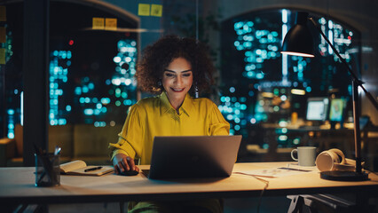 Poster - Multiethnic Female Working in Creative Agency, Implementing Modern Business Strategy for Clients. Successful Specialist Using Laptop Computer at Night in the Office.