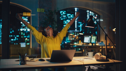 Successful Arab Female Sitting in Creative Agency, Working on Laptop Computer in the Evening. Manager Celebrating Impressive Sales Results. Excited Specialist Happy with Her Project Plan.