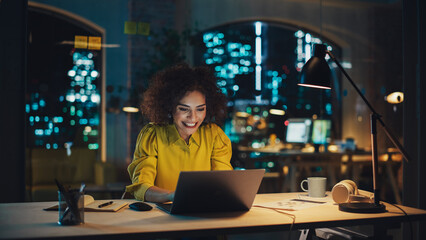 Aufkleber - Expressive Multiethnic Middle Eastern Female Working on a Creative Job Position in an Advertising Company. Manager Brainstorming Ideas, Excited for the Selection of her Project. Office at Night.