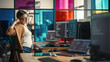© Gorodenkoff - Young Caucasian Woman Programming On Desktop Computer With Two Monitors Setup in Spacious Office. Female Software Developer Creating SaaS Platform, Stretching Before Continuing to Work.