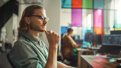 Poster - Professional Male Programmer Writing Code on Desktop Computer With Multiple Displays Setup in Stylish Office. Caucasian Man Does Data Scraping For Artificial Intelligence Innovative Start-Up.