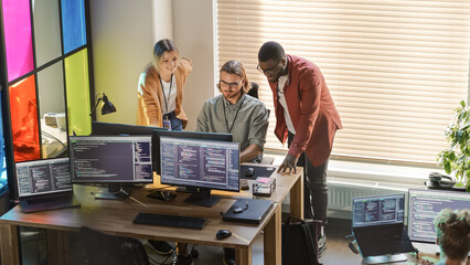 Poster - Male CEO and Female CTO Talking to Software Engineer Team Lead In Creative Office Space. Black Entrepreneur and Caucasian Business Partner Offering New Features For Their Innovative Online Service.