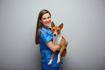 Wall Mural - Veterinarian doctor with dog. Isolated portrait.