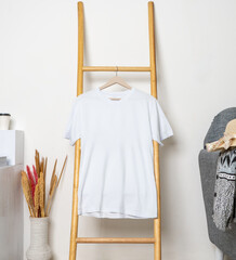 Wall Mural - A shirt hanged on to a ladder with minimalistic decorations