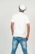 © Said - Back side of an african man with polo shirt doing a pose with white background