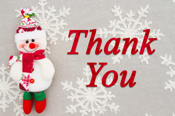 Wall Mural - Thank you message with a snowman on snowflakes