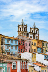 Wall Mural - Historic church tower between the roofs and facades of houses in the famous Pelourinho neighborhood in Salvador Bahia