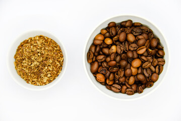 Toasted coffee beans in a porcelain cup. Coffee mixture. Delicious coffee beans and freeze-dried.