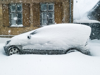 Poster - The car in the parking lot is completely covered with snow. Problems after heavy snowfall.