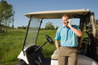 © Designpics - Man using Cell Phone on Golf Course