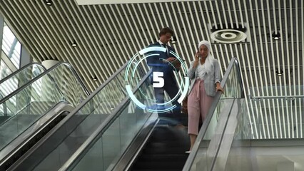 Poster - Animation of countdown over neon round scanner against diverse man and woman on escalator