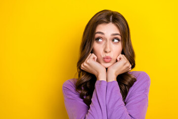 Sticker - Photo of young curly brown hair woman touch cheeks looking empty space information idea how get new boyfriend isolated on yellow color background