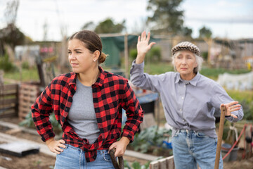 Farm neighbors quarrel over farm backyard in autumn day