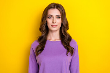 Wall Mural - Portrait of young adorable cute brown curly hairstyle lady wear purple pullover calm face after beauty salon isolated on yellow color background