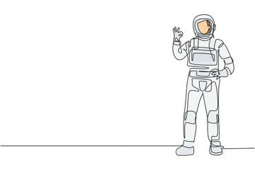 Poster - Single continuous line drawing astronaut stands with gesture okay wearing space suit exploring earth, moon, other planets in the universe. Dynamic one line draw graphic design vector illustration