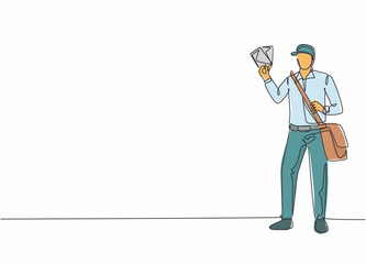 Poster - Continuous one line drawing of young mailman pose standing and holding envelopes while bringing bag. Professional job profession minimalist concept. Single line draw design vector graphic illustration