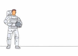 Poster - continuous one line drawing of young male astronaut pose standing and holding helmet. professional j