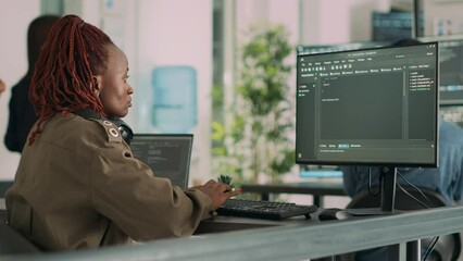 Software developer typing programming code on computer to develop online cloud computing information. Web programer writing html script and data algorithm on computer. Handheld shot.