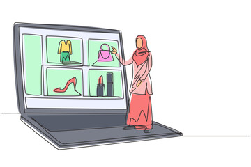 Poster - Single continuous line drawing young Arabian woman choosing shopping items on a giant laptop screen. Digital lifestyle with gadgets concept. Dynamic one line draw graphic design vector illustration