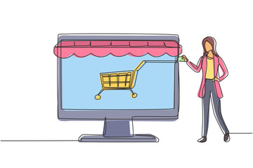 Poster - Single continuous line drawing woman inserting credit card into canopy monitor screen with shopping cart. E-shop, digital payment concept. Dynamic one line draw graphic design vector illustration