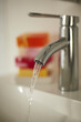 © Designpics - Close-up of Running Water from Bathroom Faucet