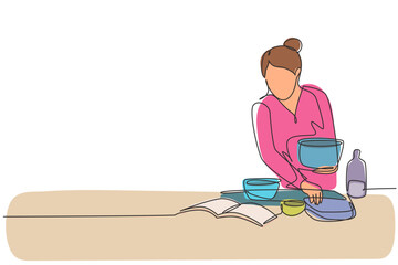 Wall Mural - Single one line drawing beautiful woman cooking meal while reading tutorial book on cozy kitchen table at home. Healthy food lifestyle. Modern continuous line draw design graphic vector illustration